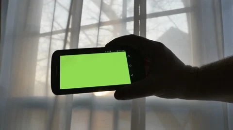 Smart Phone with Green Screen Being Held by Man, 4K Stock Footage 61452095