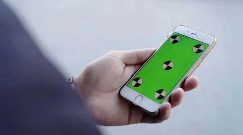 Smart Phone held by hands. Green screen Chroma Key. Close up. Tracking motion Video stock 61836429