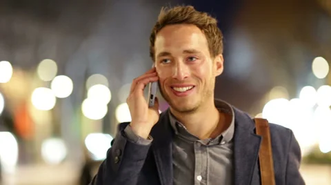 Smart phone man calling on mobile phone at night Stock Footage 37673770