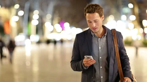 Smart phone man calling on mobile phone at night Stock Footage 37674463