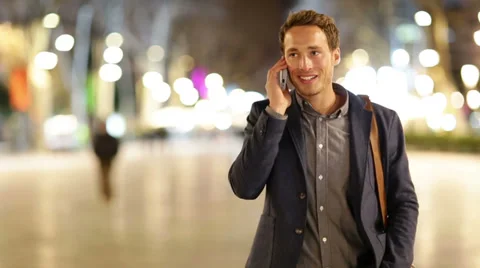 Smart phone man calling on mobile phone at night Stock Footage 37674636