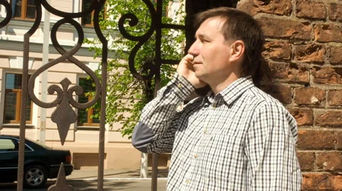 Smart phone man calling on mobile phone in city. Stock Footage 63148617