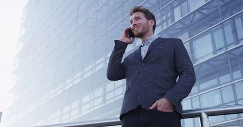 Smart phone man calling on mobile phone in city wearing suit Stock Footage 75045787