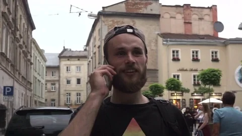 Smart phone man calling on mobile phone at night in city. Handsome young Stock Footage 78008969