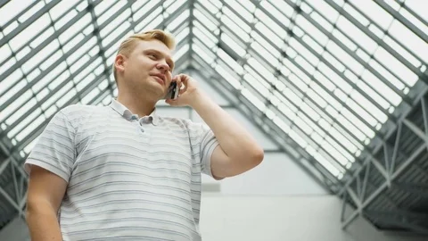 Smart phone man calling on mobile phone at night in city. Handsome young Stock Footage 82117676