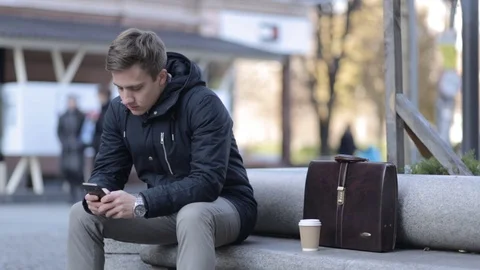 Smart phone man talking and texting in city night using smartphone Stock Footage 69880095