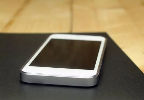 Smart phone with note book Stock Photos