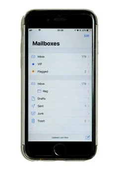 Smart phone in protective case with touchscreen, mailbox folders on display Stock Photos