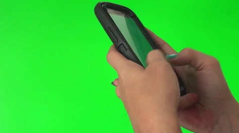 Smart phone texting on a green screen Stock Footage 27758441