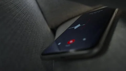 Smart phone with voice recording application is covertly grabbing conversation Stock Footage 311374504