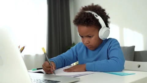 Smart primary school afro child boy learning writing Video stock 169614402