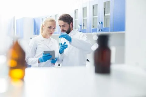 Smart professional scientists working on a project Stock Photos