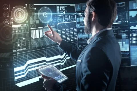 Smart programmer holding a tablet while working Stock Photos
