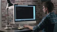 Smart Programmer Writes Line Of A Code While Sitting In His Stylish Office. Stock Footage