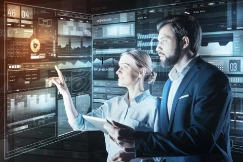 Smart programmers feeling interested and looking at the screen Stock-Fotos