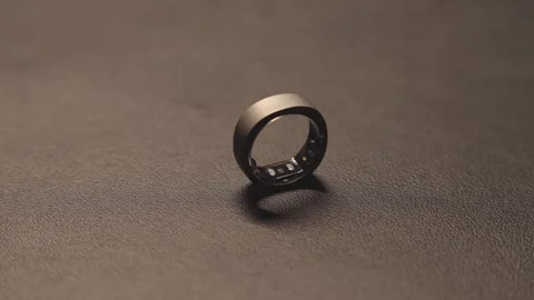 Smart ring with flashing LEDs that measure vital signs is a new technology Stock Footage 305666112