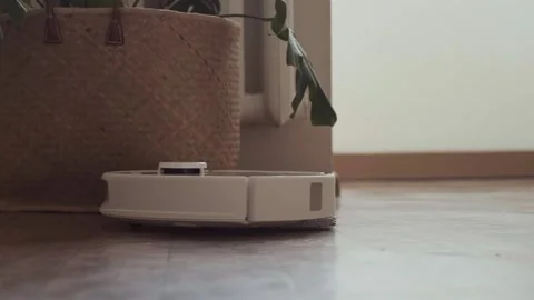 Smart robot performs dual cleaning vacuuming dust first and then mopping the Stock Footage 314642310