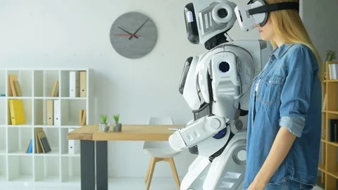 Smart robot repeating after young woman Stock Footage