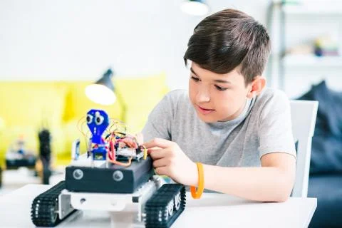 Smart schoolboy being involved in engineering classes Stock Photos