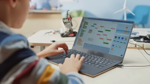 Smart Schoolboy Uses Laptop to Program Software for Robotics Engineering Class. Stock Footage 119561247