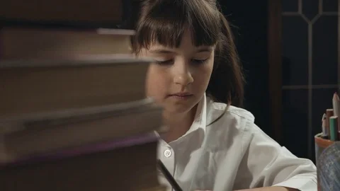 Smart Schoolgirl Studying Process 動画素材 75403327