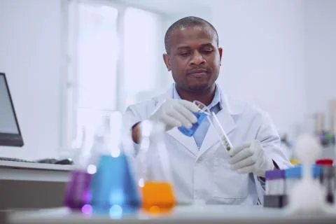 Smart scientist doing an important test Stock Photos