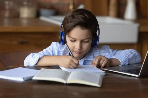 Smart small child study online on computer Stock Photos