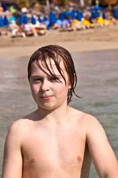 Smart smiling boy at the beach Stock Photos