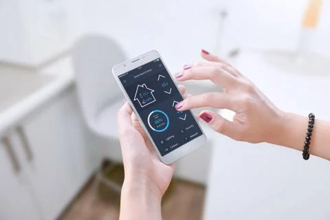 Smart software for mobile device to control apartment parameters. Stock Photos