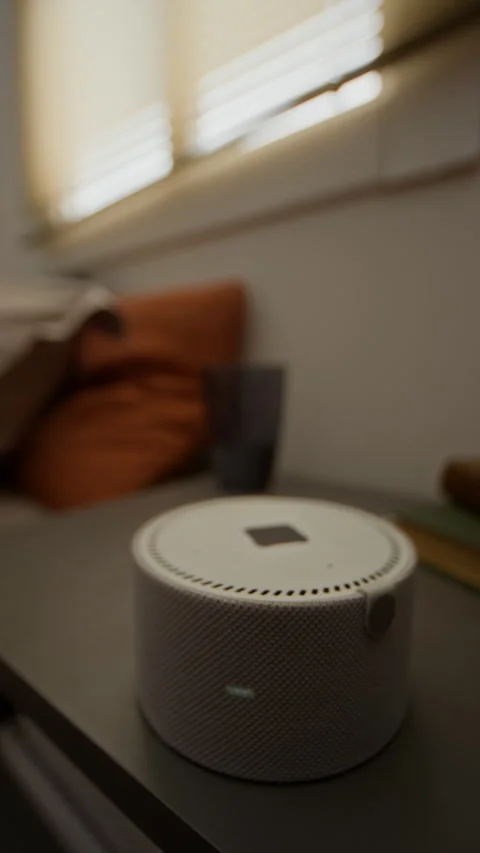 Smart Speaker with Digital Clock Displaying Voice Assistant Animation Stock Footage 340814476