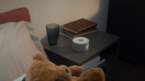 Smart Speaker with Digital Clock on Nightstand Changing Time Stock Footage 340772253