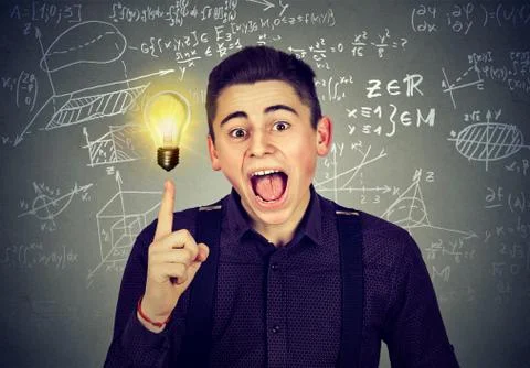 Smart student with idea light bulb science formulas on blackboard Stock Photos