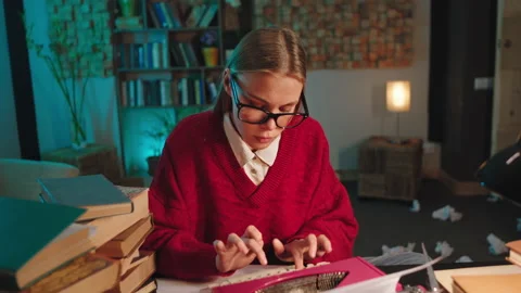 Smart student lady at home doing her project type some documents on the Stock Footage 136546894