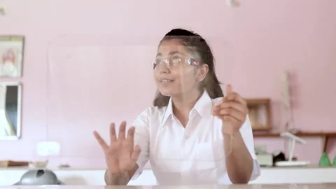 Smart student using a transparent tablet augmented reality in the classroom Stock Footage 157827386