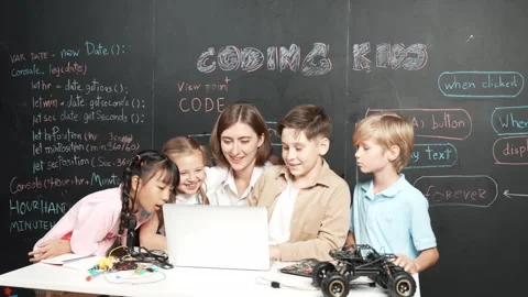 Smart teacher and diverse student looking at laptop at blackboard. Erudition. Stock Footage 270501915