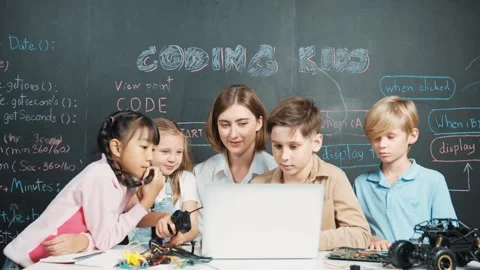 Smart teacher and diverse student looking at laptop at blackboard. Erudition. Stock Footage 274453073