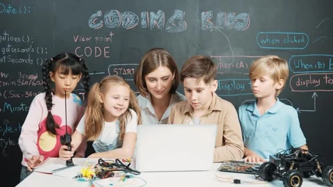 Smart teacher and diverse student looking at laptop at blackboard. Erudition. Stock Footage 275559628