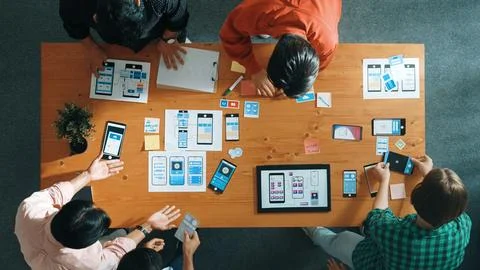 Smart team working together while brainstorm about Ux Ui design. Convocation. 写真素材