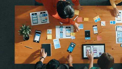 Smart team working together while brainstorm about Ux Ui design. Convocation. 写真素材