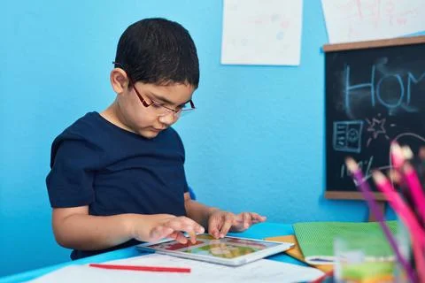 Smart technology making learning as easy as ABC. an adorable little boy using a Stock Photos