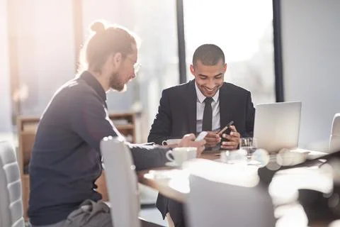 Smart technology simplifies the way they do business. two young businessmen Stock Photos
