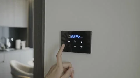 Smart Thermostat Setting for Comfortable Indoor Temperature Stock Footage 314570305