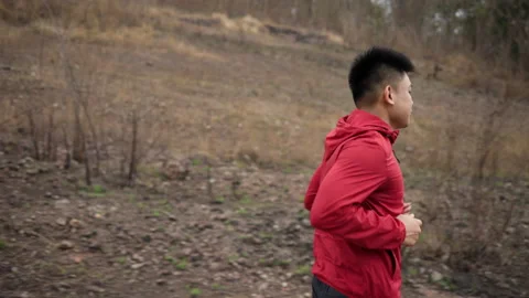 Smart trail runner man running on rocky mountain. Athlete jog, exercising. Stock Footage 171497449