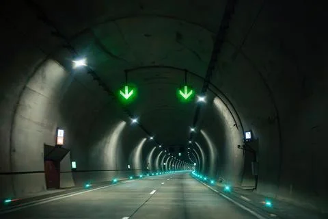 Smart tunnel traffic control system with green lane arrows inside modern Stock Photos