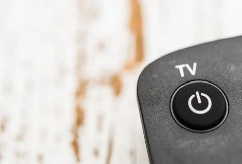 Smart tv remote control with power button. Concept of entertainment, fun, news. Stock Photos
