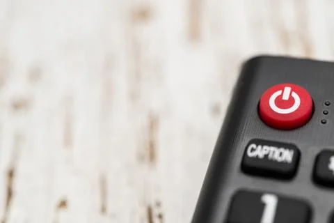 Smart tv remote control with power button. Concept of entertainment, fun, news. Stock Photos