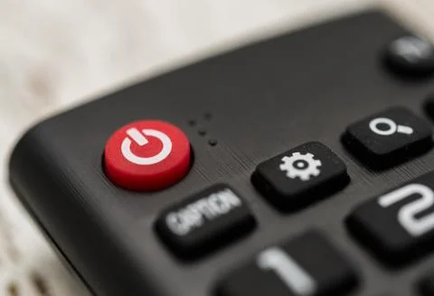Smart tv remote control with power button. Concept of entertainment, fun, news. Stock Photos