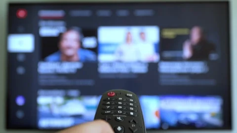 Smart tv screen and hand with remote control. Online video streaming service Stock Footage 119247073