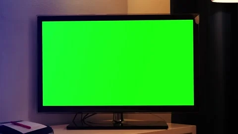 Smart TV screen with a green background on a wall background in the living room Stock Footage 332592386
