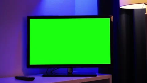 Smart TV screen with a green screen on a wall background in the living room Stock Footage 334138060